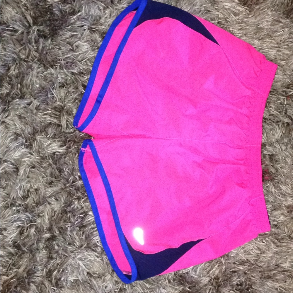 Pink and blue Nike shorts.
